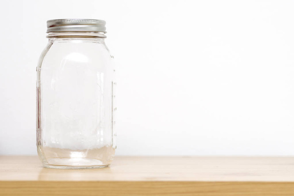 Empty jar with cover  on storage - Foto, Imagen