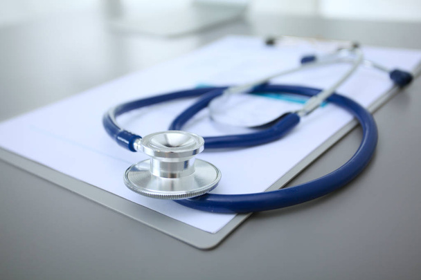 Medical equipment: blue stethoscope and tablet on white background. Medical equipment - Foto, imagen