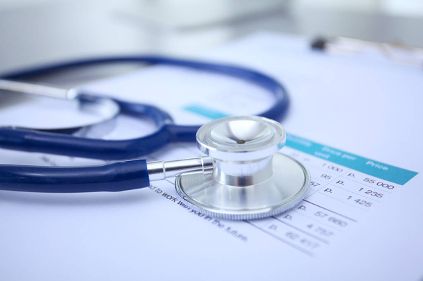 Medical equipment: blue stethoscope and tablet on white background. Medical equipment - Foto, Bild