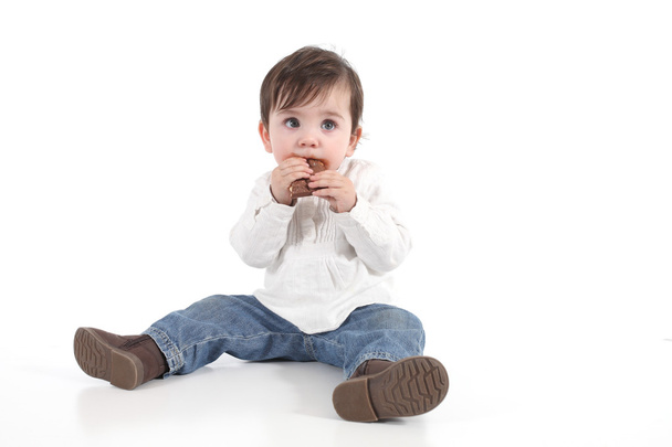 Baby eating chocolate - Foto, imagen