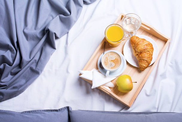 morning breakfast bed wooden tray coffee croissant - Photo, Image
