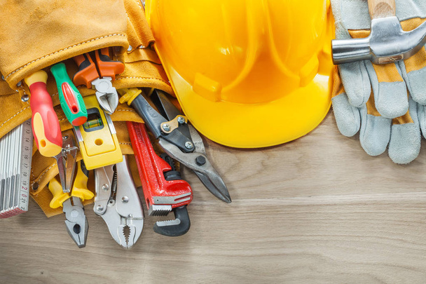 Construction tooling tool belt protective gloves building helmet - Фото, изображение