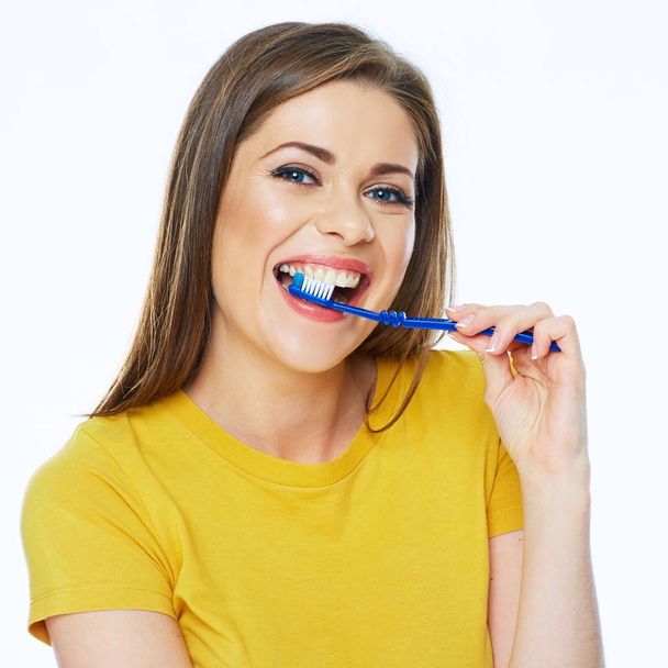 portrait of woman holding toothbrush in mouth, teeth health concept - Фото, изображение