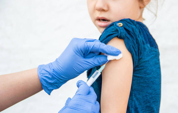 vaccination of children. An injection. Selective focus. - Photo, image