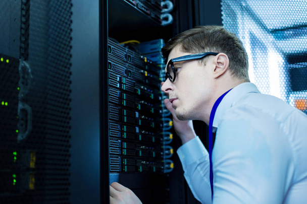 Smart operator working in the data centre - Photo, Image