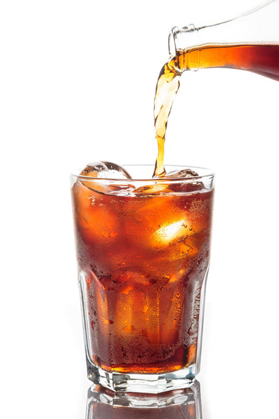 Pouring soft drink with ice cubeson white background - Photo, Image