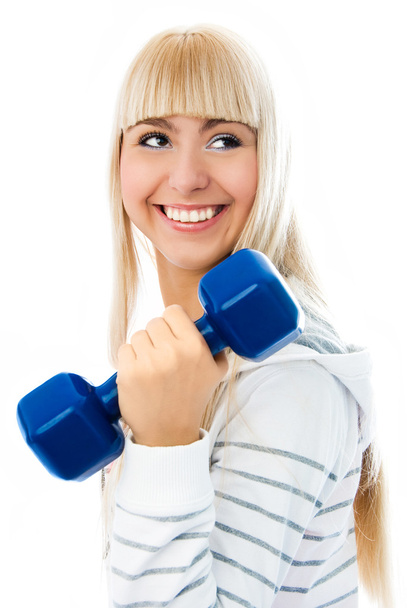 Beautiful young woman works out with dumbbells - Foto, imagen