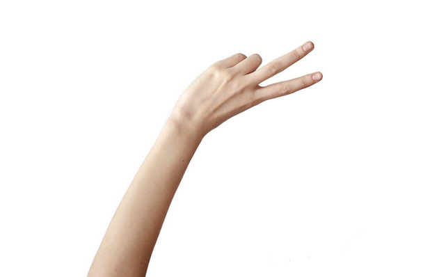 Női kéz mutatja győzelem jele - Fotó, kép