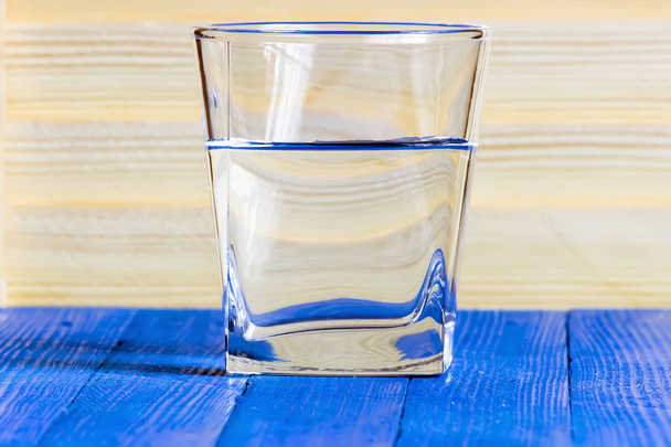 glass of water on a blue table in a restaurant - Fotoğraf, Görsel