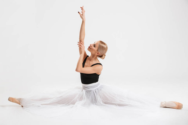 Cheerful cute young woman ballerina - Fotó, kép
