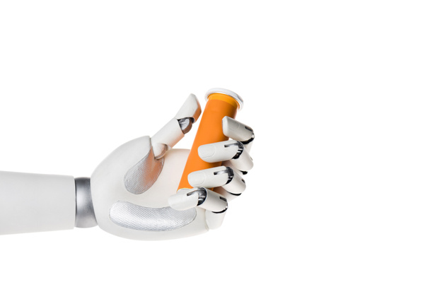 robot hand holding bottle of pills isolated on white - Photo, Image
