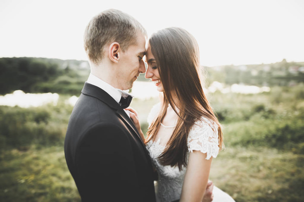 Kissing wedding couple in spring nature close-up portrait - Photo, image