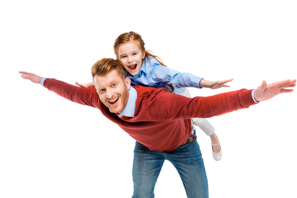 cheerful redhead father and daughter having fun together and smiling at camera isolated on white - Foto, Imagem