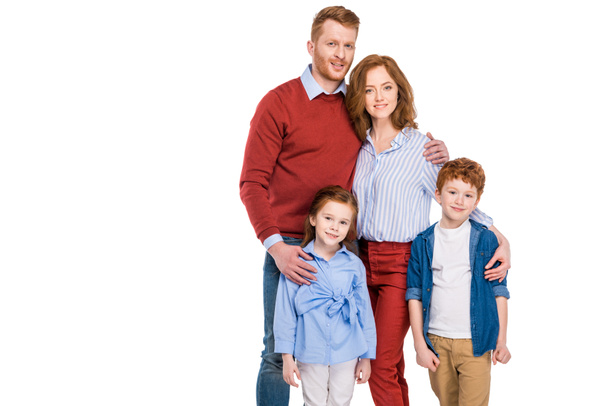 happy red haired family with two kids standing together and smiling at camera isolated on white   - Foto, immagini