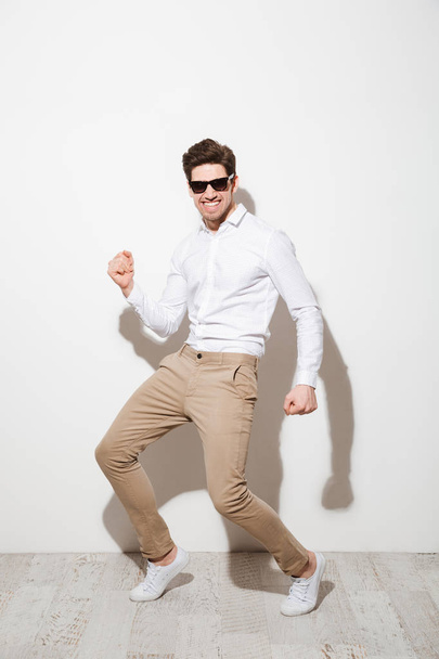 Full length portrait of a happy young man - Photo, Image