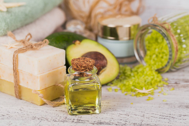 Natural cosmetic oil and natural handmade soap with avocado - Photo, image