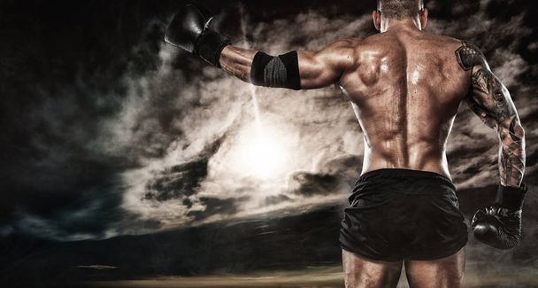 Sportsman boxer fighting outdoor. Copy Space. Boxing sport concept. - Foto, afbeelding