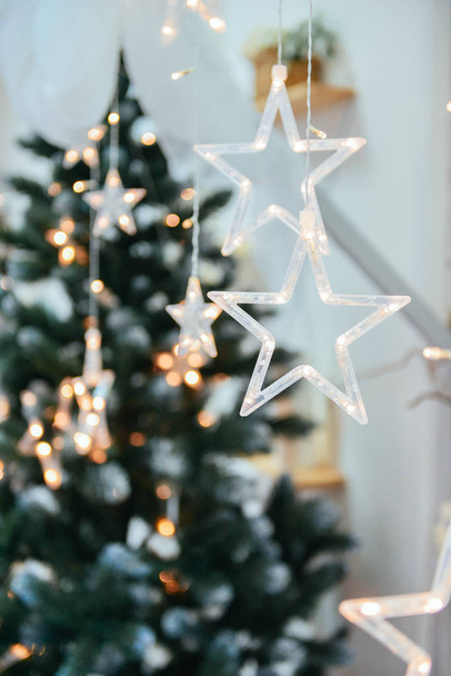 New Year background with stars on the background of a Christmas tree - Valokuva, kuva