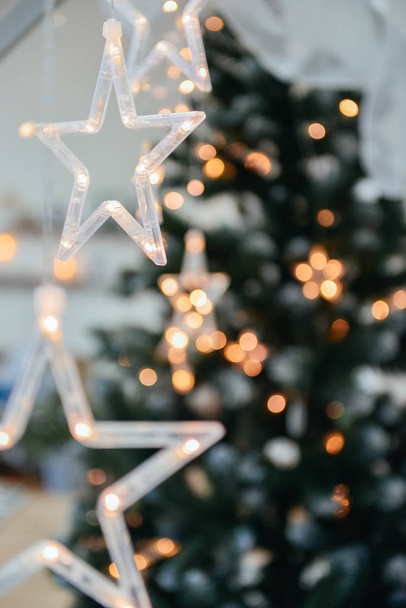 New Year background with stars on the background of a Christmas tree - Valokuva, kuva