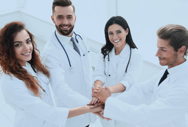 friendly team of doctors shows their success - Photo, Image