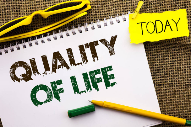 Conceptual hand writing showing Quality Of Life. Business photo showcasing Good Lifestyle Happiness Enjoyable Moments Well-being written on Notebook Book on the jute background Today Pen. - Photo, Image
