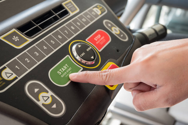 Close up of hand putting control start machine exercise - Fotografie, Obrázek