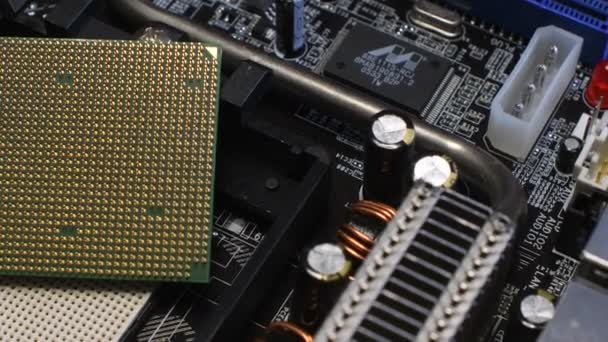 Close Up on CPU and relative Socket on PC Motherboard. Rotational 4K Video. - Footage, Video