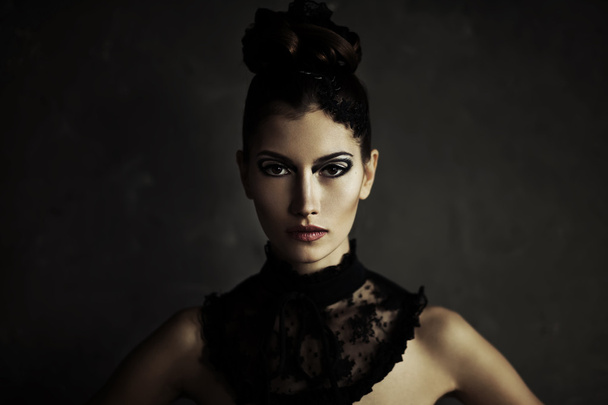 Beautiful young brunette female with fashion make-up - Foto, Imagen