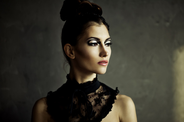 Beautiful young brunette female with fashion make-up - Photo, image