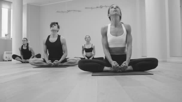 Yoga class. Ashtanga yoga. Bound angle pose - Footage, Video