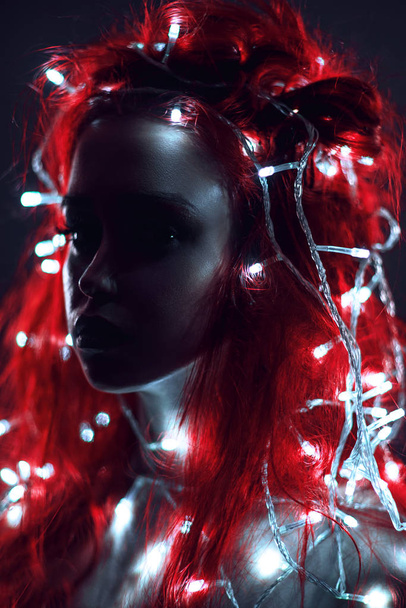 Portrait of woman with red hair and garland - Foto, Imagen