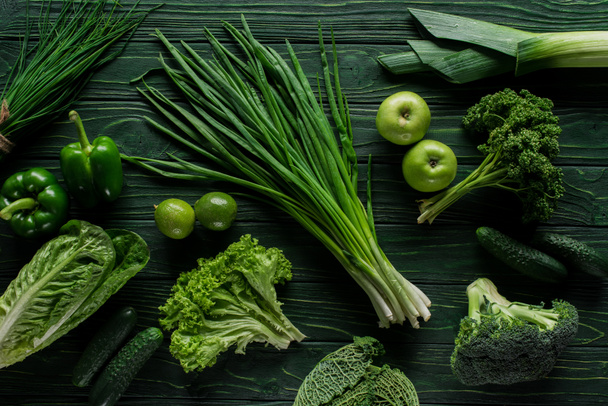 top view of green onion, apples and broccoli on wooden table, healthy eating concept - Photo, Image