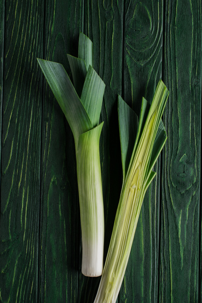 top view of green leek on wooden table, healthy eating concept - Фото, зображення