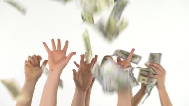 Many hands catch falling US dollars. Slow motion - Footage, Video