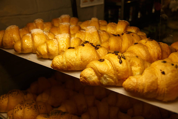 Golden croissants in the shop window - Photo, Image