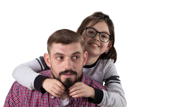 Portrait of handsome father and his cute daughter hugging, looki - Фото, зображення