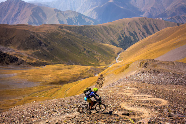 Mountain biker is travelling in the highlands of Tusheti region, - Фото, зображення