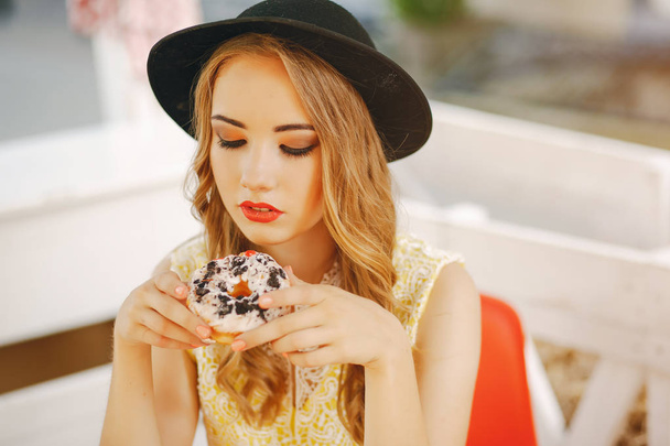 girl with donut - Фото, изображение