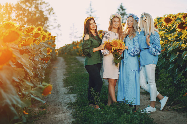 girls and sunflowers - Photo, Image
