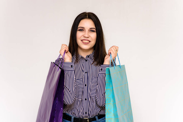 beautiful girl holding packages from the store - Fotoğraf, Görsel