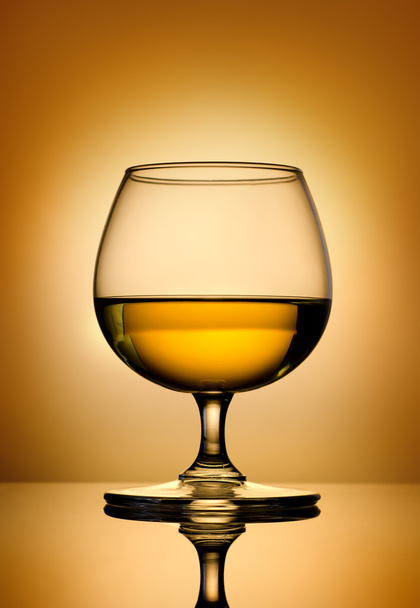 Brandy on a gold background - Foto, immagini