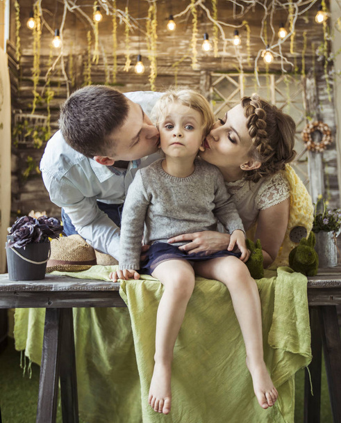 happy parents kissing their five year old daughter - Valokuva, kuva