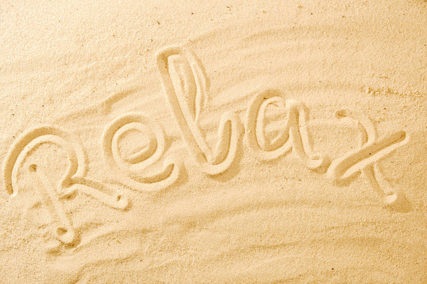 Word Relax on sand beach concept background idea - Фото, изображение