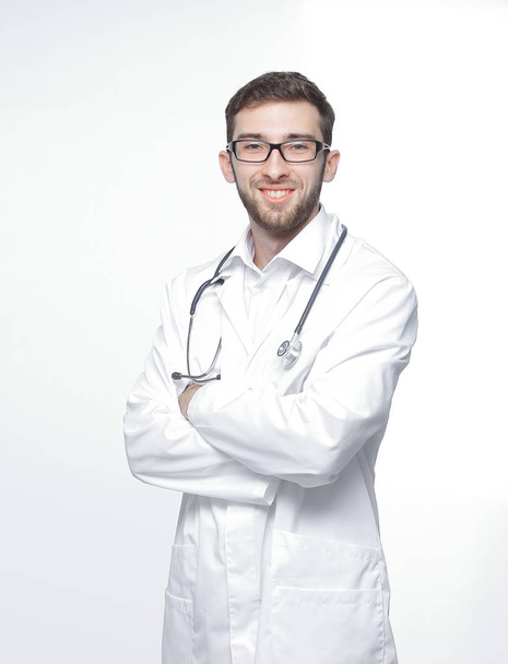 portrait of a confident doctor with a stethoscope.isolated on white - Zdjęcie, obraz
