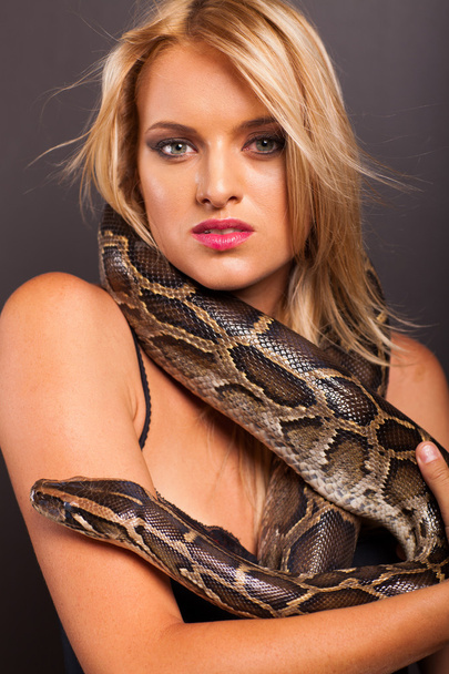 Attractive young woman with python around her neck - Photo, image