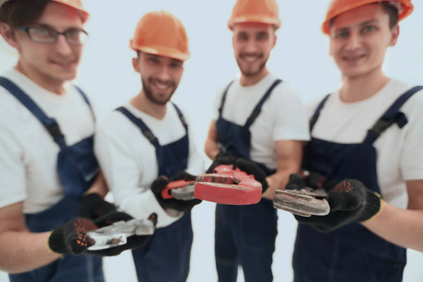 image of a group of builders with gas keys - Fotó, kép