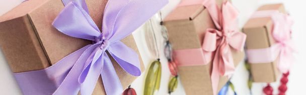 Banner Composition three cardboard boxes Satin ribbon Bow Background light. - Foto, immagini