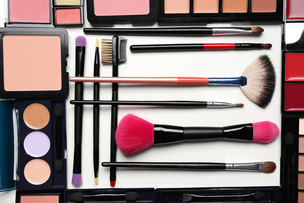 Set of decorative cosmetics and makeup brushes on white background - Photo, Image