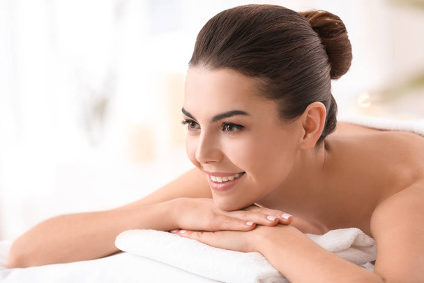 Young woman relaxing in spa salon - Photo, Image