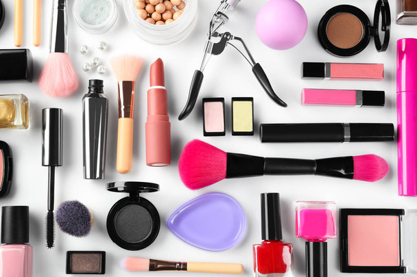 Flat lay composition with decorative cosmetics on white background - Photo, Image